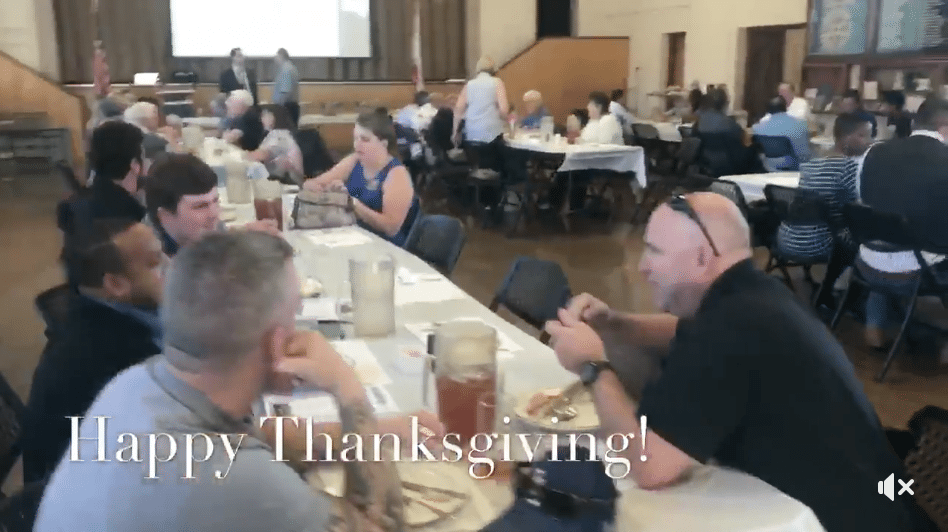 Rotarians enjoying holiday luncheon.